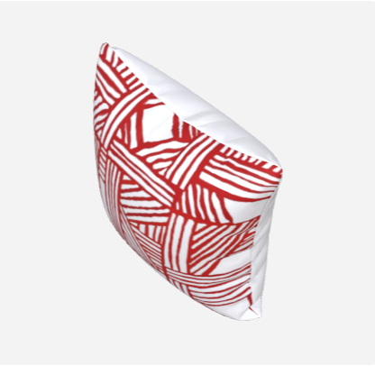 A pillowcase with a red and white geometric pattern.