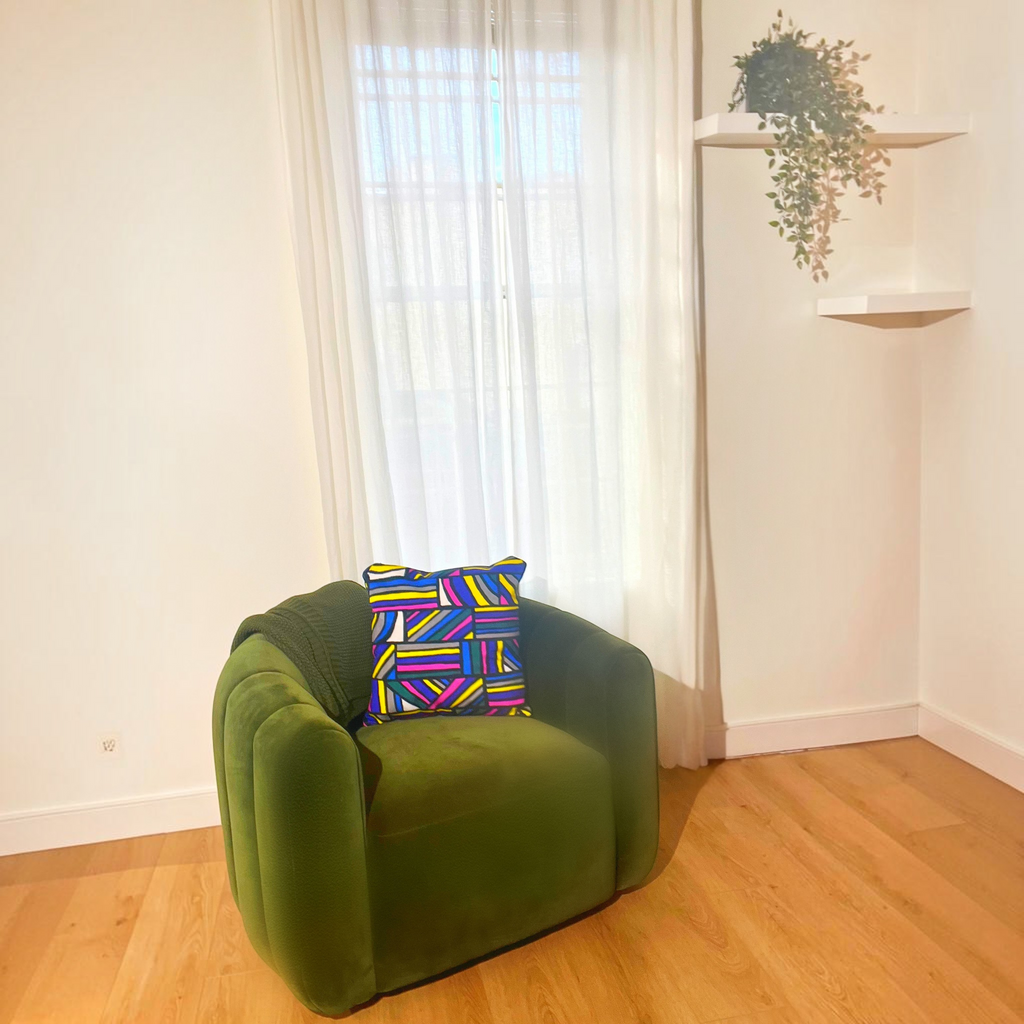 HD Decor Good Vibes decorative pillowcase with a vibrant geometric pattern on a green velvet armchair by a window